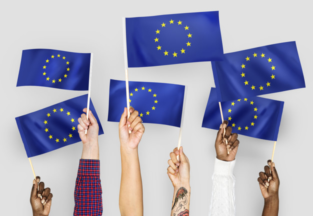 Hands waving flags of the EuropeanUnion